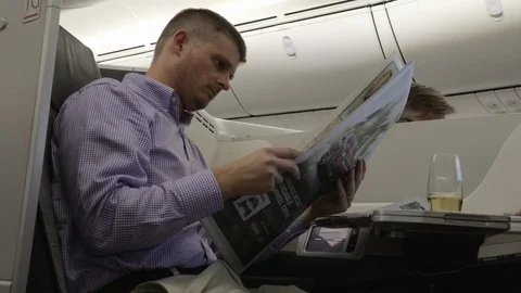 Newspaper on Plane 4K Stock Footage 89292056