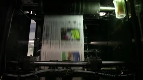 Newspaper Press, Fast moving paper on a roll in a printing factory Stock Footage 45359853