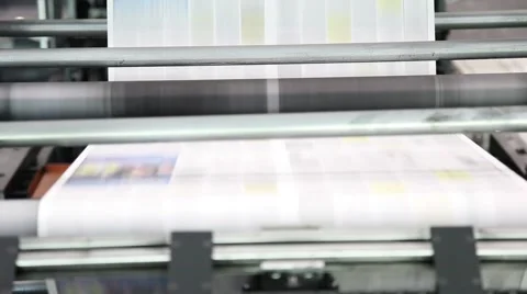 Newspaper Press, Fast moving paper on a roll in a printing factory Stock Footage 45361136