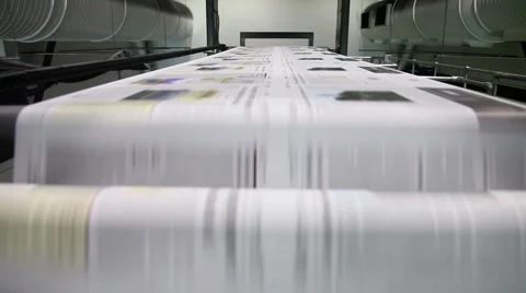 Newspaper Press, Fast moving paper on a roll in a printing factory Stock Footage