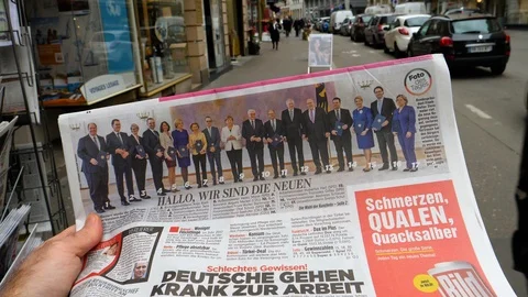 Newspaper at press kiosk featuring Angela Dorothea Merkel election Stock Footage 87223835