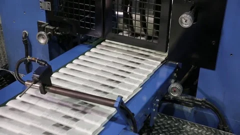 Newspaper print process. Shooting of the publishing business from a close distan Stock-Footage 75452379