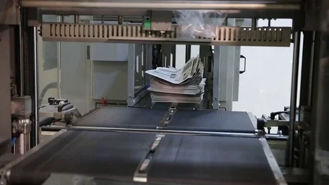 Newspaper print process. Shooting of the publishing business from a close distan Stock-Footage 75452442