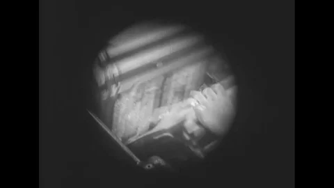 A newspaper is printed and read and laundry is washed and a library is shown Stock Footage 116491937