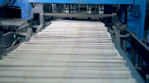 Newspaper sheets moving on a typography line, close up. Stock Footage 104225983