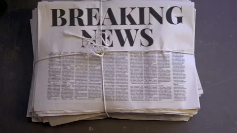 Newspaper stack being dropped onto the floor Stock Footage 152416194
