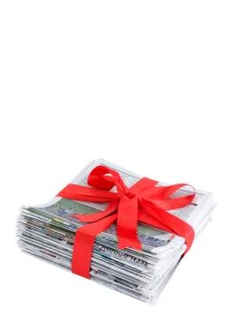 Newspaper stack with red bow Stock Photos