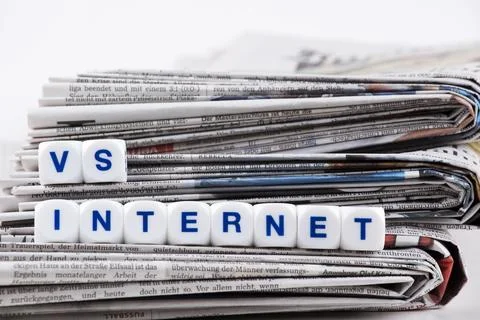 Newspaper vs internet Stock Photos