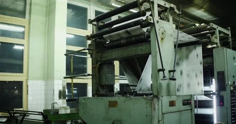Newspapers move along an assembly line in a factory 스톡 동영상 79956446