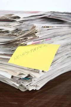 Newspapers pile on the table Stock Photos