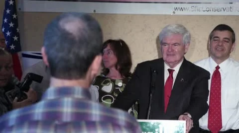 Newt Gingrich & Supporter Compare Castro To Obama Stock Footage