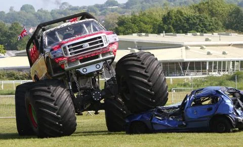 Newton Abbot: Red Dragon monster truck crushes car under its huge wheels Stock Photos