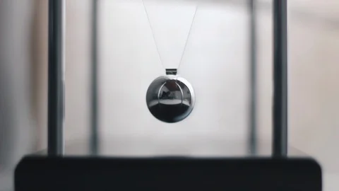 Newton Pendulum giving a perception of time and movement Stock Footage 129320041