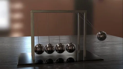 Newton's Cradle Loop 3D Animation on Desk Stock Footage 75846912