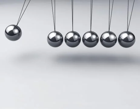 Newton's cradle over gray background Stock Photos