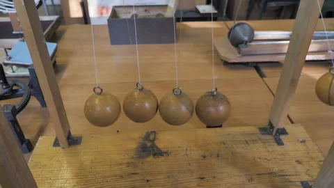 Newton's Cradle Showing Laws Of Physics In Motion. Physics Lesson In The School Stock Footage 137939345