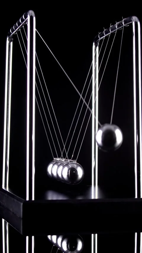 Newton's Cradle Slow Motion. Vertical video. Stock Footage 336004970