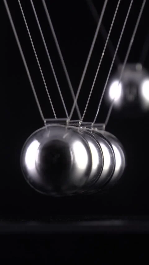 Newton's Cradle Slow Motion. Vertical video. Stock Footage 337435459