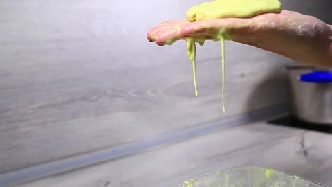 Newton's fluid flows into women’s hand Stock Footage 125481724