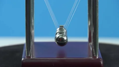 Newton's pendulum on a blue background works, soft focus Stock Footage 135921187