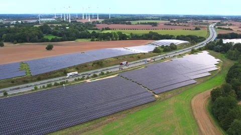 Next to the freeway A20 in Germany is a solar park Stock Footage 251524006