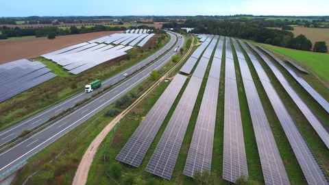 Next to the freeway A20 in Germany is a solar park Stock Footage 251524070