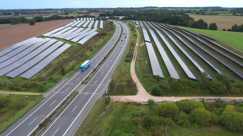 Next to the freeway A20 in Germany is a solar park Stock Footage 251524108