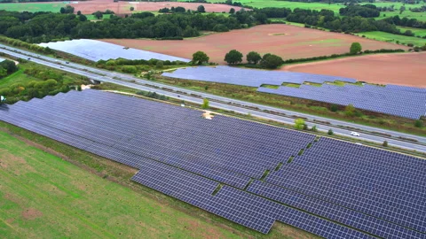 Next to the freeway A20 in Germany is a solar park Stock Footage 251524170