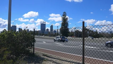 Next to freeway with city skyline in the background Stock Footage 94550875