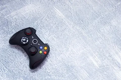 Next-generation game controllers. Two black gamepads. Black joystick. Stock Photos