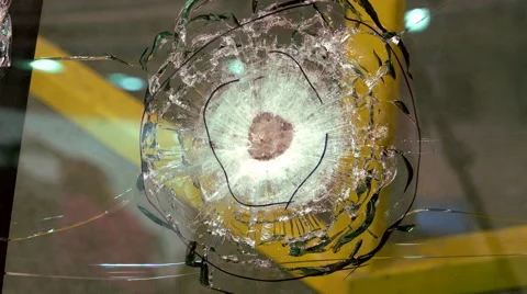 Next on the Glass From Falling Projectile Visible Epicenter and Cracked Edges Stock Footage 68601442