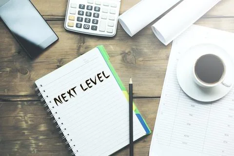 Next level text on notepad Stock Photos