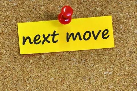 Next move  word on notes paper with cork background Foto stock
