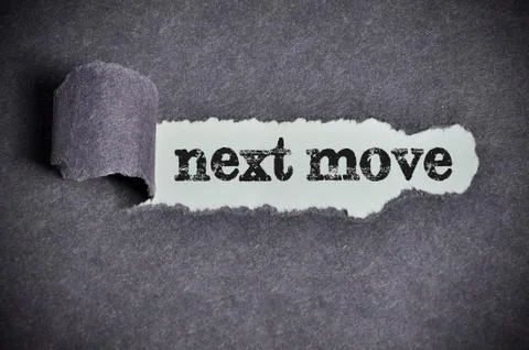 Next move word under torn black sugar paper Foto stock