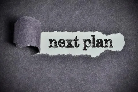 Next plan word under torn black sugar paper Stock Photos