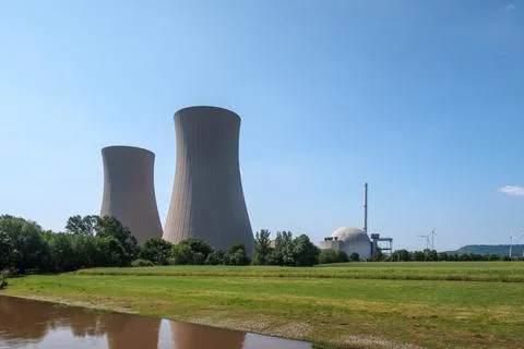 Next to a river is a nuclear power plant Stock Photos