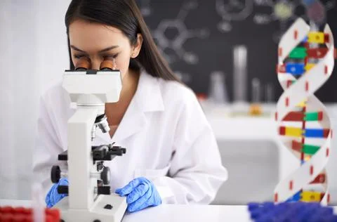 The next stage of human evolution. Profile of a female scientist viewing a Stock Photos