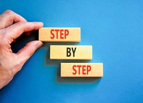 Next step words symbol. Concept words Step by step on beautiful wooden bloc.. Stock Photos