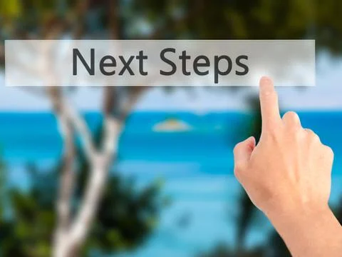 Next Steps - Hand pressing a button on blurred background concept on visual s Stock Photos
