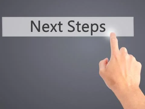 Next Steps - Hand pressing a button on blurred background concept on visual s Stock Photos