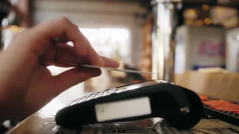 NFC technology. Close-up of man using credit card with NFC chip on terminal. Stock Footage 141196117