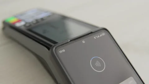 NFC technology makes payment simple and fast. See how to pay using your Stock Footage 247313314
