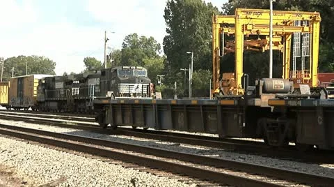 NFS TRAIN ENTERS FREIGHT YARD Stock Footage 11145409