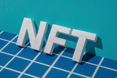 NFT letters and shadow on a blue background with a gridded pixel in cyberspace 스톡 일러스트