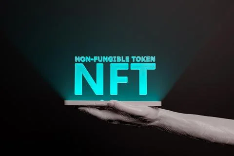 NFT word on the mobile phone held by an electronic hand Stock Illustration