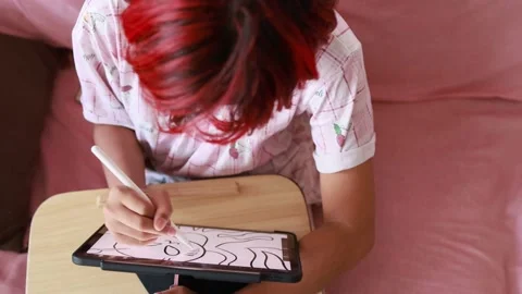 NFT work concept, Red hair artist girl using digital pen drawing sketching Stock Footage 180979999