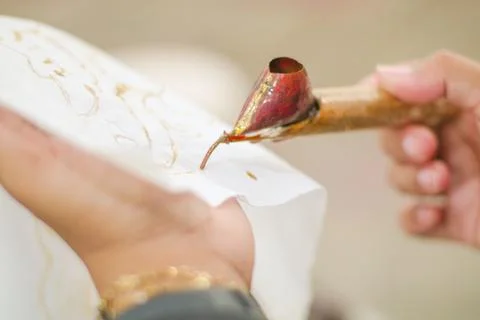 Ngeresi batik is The process of making batik still uses the traditional can.. Stock Photos