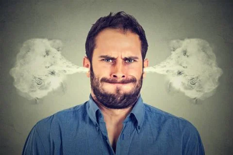 Ngry young man, blowing steam coming out of ears Stock Photos