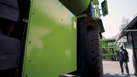 NHL TR50E mining dump truck warehouse inspection. Descending lateral aerial 스톡 동영상 332519053