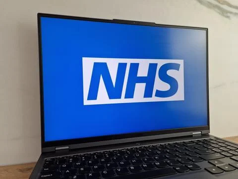 NHS logo displayed on laptop Stock Photos